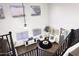 Open-concept living room with large windows, modern decor, and a cozy seating area at 8221 W Hess Ave, Phoenix, AZ 85043