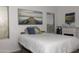 This bright bedroom features a large bed, and is naturally lit via two large windows at 8221 W Hess Ave, Phoenix, AZ 85043