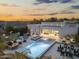 This aerial view showcases a modern home with an expansive backyard featuring a pool, spa, lounge and outdoor kitchen at 8245 E Via Del Sol Dr, Scottsdale, AZ 85255