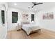 Relaxing bedroom with natural light, modern ceiling fan and neutral decor at 8245 E Via Del Sol Dr, Scottsdale, AZ 85255