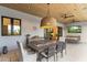 Inviting covered patio with a dining area, cozy seating, and views of the landscaped backyard at 8245 E Via Del Sol Dr, Scottsdale, AZ 85255
