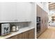 Bright kitchen featuring white countertops and wood cabinetry, plus a built in oven and stainless steel appliances at 8245 E Via Del Sol Dr, Scottsdale, AZ 85255