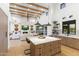 Stylish kitchen with a central island, stainless steel appliances, and seamless transition to the living room at 8245 E Via Del Sol Dr, Scottsdale, AZ 85255
