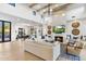 Open-concept living room with a fireplace, a sleek TV, comfortable seating, and seamless access to the dining area at 8245 E Via Del Sol Dr, Scottsdale, AZ 85255