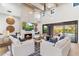 Bright and airy living room with high ceilings, modern fireplace, comfortable seating, and seamless indoor-outdoor flow at 8245 E Via Del Sol Dr, Scottsdale, AZ 85255