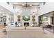 Bright living room features a fireplace, built-in benches, TV, and elegant decor for a cozy and inviting space at 8245 E Via Del Sol Dr, Scottsdale, AZ 85255