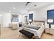 Open main bedroom with seating area, plush bedding, and plenty of natural light at 8245 E Via Del Sol Dr, Scottsdale, AZ 85255