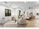 Bright and airy main bedroom with sitting area, hardwood floors and modern ceiling fan at 8245 E Via Del Sol Dr, Scottsdale, AZ 85255