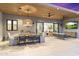 This beautiful outdoor patio features ceiling fans, ample seating, a dining area and an outdoor television at 8245 E Via Del Sol Dr, Scottsdale, AZ 85255