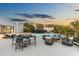 This backyard features a large pool, spa, multiple lounge areas, an outdoor kitchen, and drought-resistant landscaping at 8245 E Via Del Sol Dr, Scottsdale, AZ 85255
