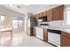 Well-lit kitchen with stainless steel appliances and ample cabinet space, perfect for cooking and entertaining at 8576 E Jasper St, Gold Canyon, AZ 85118