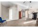 Spacious living room with plush carpeting and neutral paint, offering a versatile living space at 8576 E Jasper St, Gold Canyon, AZ 85118