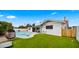 Backyard with a pool, lounge chairs, and well-manicured landscaping at 8631 E Jackrabbit Rd, Scottsdale, AZ 85250