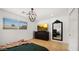 Bedroom featuring a modern chandelier, dark dresser, and clean lines at 8631 E Jackrabbit Rd, Scottsdale, AZ 85250