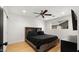Bedroom with a ceiling fan, natural light, wood floors, and closet at 8631 E Jackrabbit Rd, Scottsdale, AZ 85250