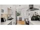 Modern kitchen with stainless steel appliances, quartz countertops, and ample storage space at 8631 E Jackrabbit Rd, Scottsdale, AZ 85250