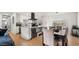 Bright, open kitchen boasts modern white cabinets, stainless steel appliances, and a functional island at 8631 E Jackrabbit Rd, Scottsdale, AZ 85250
