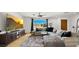 Cozy living room featuring a large window, a modern sectional couch and stylish furnishings at 8631 E Jackrabbit Rd, Scottsdale, AZ 85250
