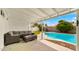 Covered patio overlooking a pool and green landscaping at 8631 E Jackrabbit Rd, Scottsdale, AZ 85250