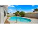 Backyard featuring a pool, a covered patio, and a privacy fence at 8631 E Jackrabbit Rd, Scottsdale, AZ 85250