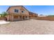 Large backyard offers a covered patio and ample space for creating your dream outdoor living area at 906 S 242Nd Dr, Buckeye, AZ 85326