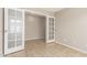 Inviting bedroom featuring tile flooring, neutral paint, and ample natural light at 906 S 242Nd Dr, Buckeye, AZ 85326