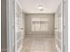 Bright bedroom with tile flooring, neutral paint, and natural light at 906 S 242Nd Dr, Buckeye, AZ 85326