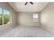 Bright bedroom featuring neutral walls, carpet flooring, and two windows for natural light at 906 S 242Nd Dr, Buckeye, AZ 85326