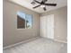 Bedroom features neutral walls, carpet flooring, and a sliding door closet with good natural light at 906 S 242Nd Dr, Buckeye, AZ 85326