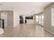 Open-concept living area connects to a kitchen, providing ample space and natural light at 906 S 242Nd Dr, Buckeye, AZ 85326