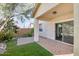 Back patio featuring desert landscaping, low walls, and sliding glass door entry at 935 E Redondo Dr, Gilbert, AZ 85296