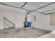 Spacious garage with high ceilings, storage area, and modern fixtures at 935 E Redondo Dr, Gilbert, AZ 85296