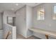 Hallway with windows and a built-in desk area, illuminated by natural light at 935 E Redondo Dr, Gilbert, AZ 85296