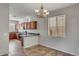 Kitchen with tiled floor, cherry wood cabinets, stainless appliances and granite countertops at 935 E Redondo Dr, Gilbert, AZ 85296