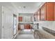 Kitchen with cherry wood cabinets, stainless steel appliances and granite countertops at 935 E Redondo Dr, Gilbert, AZ 85296