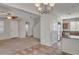 Open living room showing both carpet and tile flooring, staircase and kitchen bar at 935 E Redondo Dr, Gilbert, AZ 85296