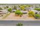 This is an aerial view of the home with mature trees, and ample parking space at 10437 E Boulder Dr, Apache Junction, AZ 85120