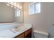 A bathroom with a single sink, large mirror, and tile floors at 10437 E Boulder Dr, Apache Junction, AZ 85120
