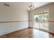 Dining area with hardwood floors, sliding glass door to the backyard at 10437 E Boulder Dr, Apache Junction, AZ 85120