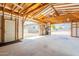 Inside the open garage, exposed beams, concrete floor, and natural light at 10437 E Boulder Dr, Apache Junction, AZ 85120