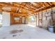 Open garage with exposed wood framing, concrete floor and backyard access at 10437 E Boulder Dr, Apache Junction, AZ 85120