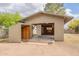 Detached garage with an open bay and a smaller attached storage shed at 10437 E Boulder Dr, Apache Junction, AZ 85120