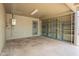 Attached garage with storage shelving and a door leading to the exterior at 10437 E Boulder Dr, Apache Junction, AZ 85120