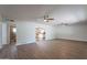 Spacious living room with hardwood flooring and ceiling fans for added comfort at 10437 E Boulder Dr, Apache Junction, AZ 85120