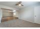 Bright living room with carpeting and open layout, perfect for entertaining guests at 10437 E Boulder Dr, Apache Junction, AZ 85120