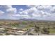 Community aerial view showcasing the neighborhood, golf course, nearby mountains and picturesque scenery at 11003 E Kiva Ave, Mesa, AZ 85209