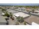 Aerial view of a well-maintained home with a tiled roof, covered patio, and desert landscaping at 11003 E Kiva Ave, Mesa, AZ 85209