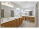 Spacious bathroom with double vanity, large mirrors, and ample storage space at 11003 E Kiva Ave, Mesa, AZ 85209
