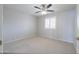 Neutral bedroom featuring a ceiling fan and shuttered windows for comfortable living at 11003 E Kiva Ave, Mesa, AZ 85209