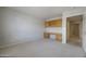 Spacious bedroom features a built-in desk and cabinetry for convenient organization at 11003 E Kiva Ave, Mesa, AZ 85209